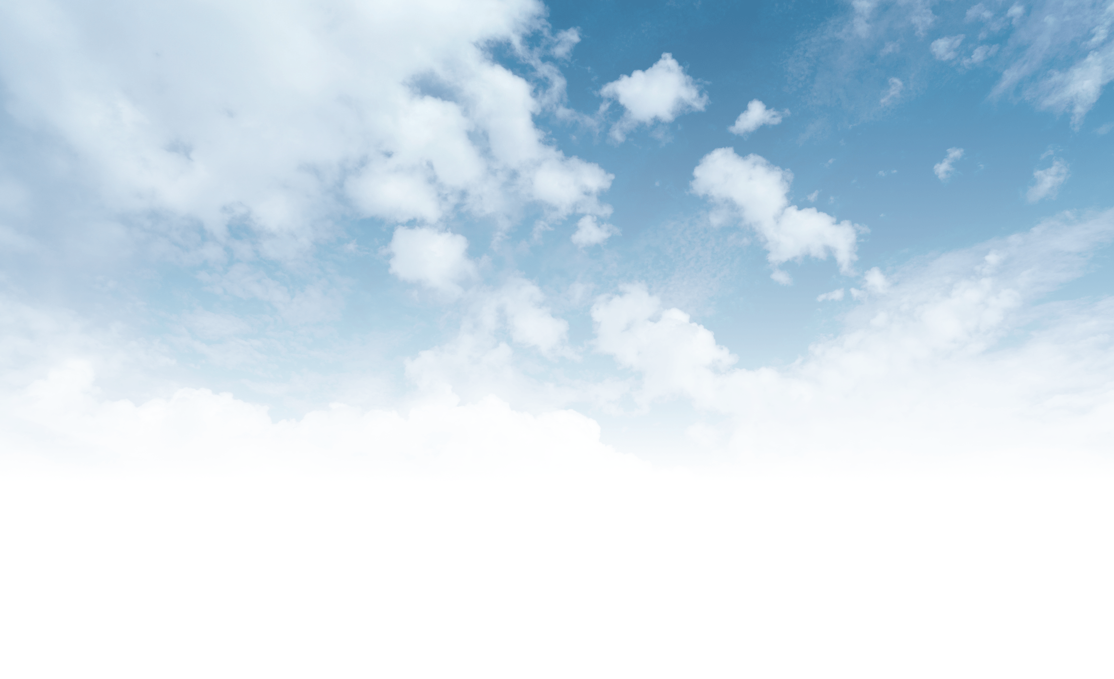 The image shows a clear, blue sky with scattered white clouds, creating a peaceful and serene atmosphere. No landmarks are visible.
